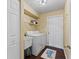 Well-equipped laundry room with washer, dryer, and storage shelves at 1762 Ne 39Th St, Ocala, FL 34479
