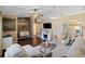 Open-concept living room with a fireplace, comfortable seating, and an inviting atmosphere at 1762 Ne 39Th St, Ocala, FL 34479