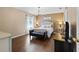 Main bedroom featuring a decorative chandelier, bench, and neutral decor at 1762 Ne 39Th St, Ocala, FL 34479
