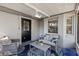 Enclosed back porch features ample seating and a ceiling fan at 1762 Ne 39Th St, Ocala, FL 34479