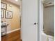 Compact bathroom with a tub-shower combination and framed baby photos on the wall at 906 Crestview Dr, Auburndale, FL 33823