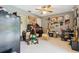 Bedroom with a unique collection of decor and a refrigerator, perfect for a hobby room or storage at 906 Crestview Dr, Auburndale, FL 33823
