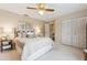 Inviting bedroom with neutral tones and large windows showcasing outdoor light at 906 Crestview Dr, Auburndale, FL 33823