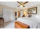 Comfortable bedroom with neutral tones, ceiling fan, and ample storage space at 906 Crestview Dr, Auburndale, FL 33823