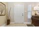 Well-lit entryway with a decorative front door, stylish decor, and a cozy ambiance at 906 Crestview Dr, Auburndale, FL 33823