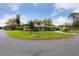 Spacious single-story home boasting lush front lawn and mature trees in a serene neighborhood setting at 906 Crestview Dr, Auburndale, FL 33823