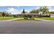 Charming single-story home with well-maintained landscaping and a circular driveway enhancing its curb appeal at 906 Crestview Dr, Auburndale, FL 33823
