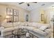 Comfortable living room with a large sectional sofa, decorative artwork, and a cozy atmosphere at 906 Crestview Dr, Auburndale, FL 33823
