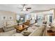 Spacious living room area leading into the dining room and open kitchen at 906 Crestview Dr, Auburndale, FL 33823