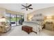 Bright main bedroom with sliding glass doors leading to the pool area at 906 Crestview Dr, Auburndale, FL 33823