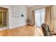 Bedroom with hardwood floors, light-colored walls, and sliding glass doors with natural light at 915 Ashmeade Ct, Port Orange, FL 32127