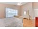 Bright bedroom with wood floors, a ceiling fan, neutral walls and a window with sheer curtains at 915 Ashmeade Ct, Port Orange, FL 32127