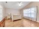 Light and bright bedroom featuring wood floors, ceiling fan, and abundant natural light at 915 Ashmeade Ct, Port Orange, FL 32127