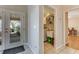 Home entryway showcases the laundry room with sink, shelving, and access to back yard at 915 Ashmeade Ct, Port Orange, FL 32127