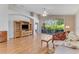 Spacious living room featuring high ceilings, hardwood floors, and access to the lanai at 915 Ashmeade Ct, Port Orange, FL 32127