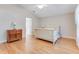 Spacious main bedroom featuring hardwood floors and a decorative dresser at 915 Ashmeade Ct, Port Orange, FL 32127