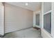 Covered patio with concrete flooring, neutral siding, ceiling light, and view of yard at 915 Ashmeade Ct, Port Orange, FL 32127