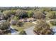 Overhead view of house with a detached two-car garage situated on a spacious lot with mature trees at 5238 Ne 1St Ave, Ocala, FL 34479