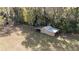 Aerial view shows backyard shed in a private wooded setting at 5238 Ne 1St Ave, Ocala, FL 34479