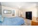 Bedroom featuring a safe, wood-look vinyl floors, and ensuite access at 5238 Ne 1St Ave, Ocala, FL 34479