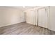 Well-lit bedroom featuring wood-look floors, a ceiling fan, and neutral wall color at 5238 Ne 1St Ave, Ocala, FL 34479