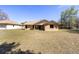 Home's exterior with a lush green lawn and neutral color palette at 5238 Ne 1St Ave, Ocala, FL 34479