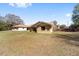 View of home with green lawn and neutral color, exuding curb appeal at 5238 Ne 1St Ave, Ocala, FL 34479