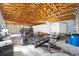 Spacious garage interior with exposed wooden beams, concrete floors, and a mix of stored equipment at 5238 Ne 1St Ave, Ocala, FL 34479