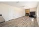 Living room offers modern flooring, natural light, and stone fireplace at 5238 Ne 1St Ave, Ocala, FL 34479