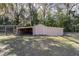 View of backyard shed in a private, wooded setting at 5238 Ne 1St Ave, Ocala, FL 34479