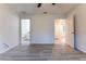 Well-lit bedroom with light wood flooring and easy access to the Primary bath at 24009 Sw Huckleberry Ln, Dunnellon, FL 34431