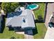 An aerial view of a home with a fenced backyard and in-ground pool at 8400 Mattituck Cir, Orlando, FL 32829