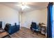 Well-lit bedroom with hardwood floors, ceiling fan, and bright natural light at 8400 Mattituck Cir, Orlando, FL 32829