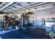 Garage interior with workout equipment, laundry, and utility sink, creating a functional, multi-use space at 8400 Mattituck Cir, Orlando, FL 32829