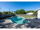 Backyard featuring an in-ground swimming pool, bordered by a paver patio and a well-maintained fence at 8400 Mattituck Cir, Orlando, FL 32829