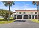 A view of the condo complex with private garages and well-maintained landscaping at 26 Ocean Palm Villa S # 26, Flagler Beach, FL 32136
