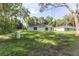 Expansive backyard featuring a well and complemented by the home's exterior at 18 Malauka Loop Pass, Ocklawaha, FL 32179