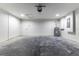 A spacious garage with sealed concrete floors provides ample storage and functionality at 18 Malauka Loop Pass, Ocklawaha, FL 32179