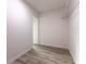 Bright walk-in closet features light gray flooring and metal shelving on the back wall at 18 Malauka Loop Pass, Ocklawaha, FL 32179