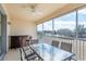 Relaxing screened balcony with outdoor dining set and bar area at 4410 Sw 52Nd Cir # 108, Ocala, FL 34474