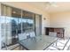 Screened balcony with outdoor dining set, beautiful views and a bar area at 4410 Sw 52Nd Cir # 108, Ocala, FL 34474