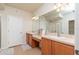 This modern bathroom features dual sinks, a large mirror, and bright lighting at 4410 Sw 52Nd Cir # 108, Ocala, FL 34474