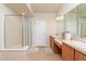 The modern bathroom features dual sinks, tiled floor and an enclosed glass shower at 4410 Sw 52Nd Cir # 108, Ocala, FL 34474