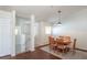Bright dining room with wood floors, rug and dining table set with six chairs at 4410 Sw 52Nd Cir # 108, Ocala, FL 34474