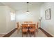 Bright dining room featuring hardwood floors, area rug and wood table at 4410 Sw 52Nd Cir # 108, Ocala, FL 34474