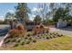 Stone monument sign, enhanced by colorful landscaping, marks the entrance to Brighton community at 4410 Sw 52Nd Cir # 108, Ocala, FL 34474