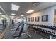 Bright and modern gym featuring weightlifting machines, free weights, and motivational wall art at 4410 Sw 52Nd Cir # 108, Ocala, FL 34474