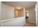Hallway with carpet and light-colored walls leading to a room with natural light at 4410 Sw 52Nd Cir # 108, Ocala, FL 34474