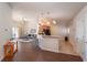 Open-concept living room and kitchen layout with hardwood floors and access to the patio at 4410 Sw 52Nd Cir # 108, Ocala, FL 34474