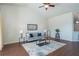 Spacious living room featuring a comfortable sofa and hardwood floors at 4410 Sw 52Nd Cir # 108, Ocala, FL 34474